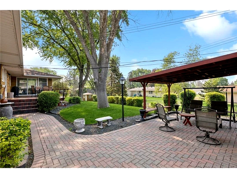 Backyard patio at group home in Burnsville MN providing comfortable outdoor space for residents in assisted living
